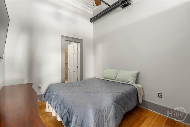 301 W Broughton St Unit 3B, Savannah, GA 31401 - bedroom featuring wood finished floors and baseboards