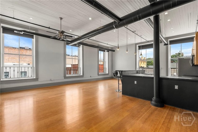 301 W Broughton St Unit 3B, Savannah, GA 31401 - rec room featuring wood finished floors, plenty of natural light, a ceiling fan, and a sink