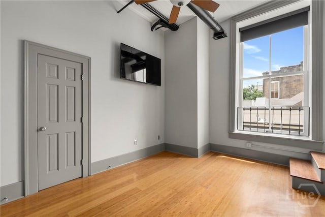 301 W Broughton St Unit 3B, Savannah, GA 31401 - spare room featuring ceiling fan, wood finished floors, and baseboards