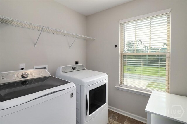 304 Boomer Ct, Guyton, GA 31312 - laundry area with washer and dryer, healthy amount of natural light, and baseboards