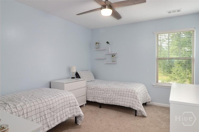 304 Boomer Ct, Guyton, GA 31312 - bedroom with light carpet, multiple windows, a ceiling fan, and baseboards