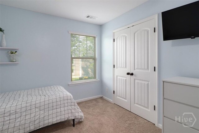 304 Boomer Ct, Guyton, GA 31312 - carpeted bedroom featuring a closet and baseboards