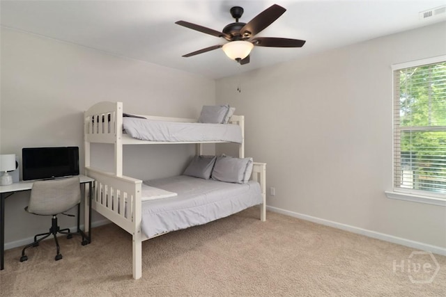 304 Boomer Ct, Guyton, GA 31312 - bedroom with carpet flooring, multiple windows, baseboards, and ceiling fan