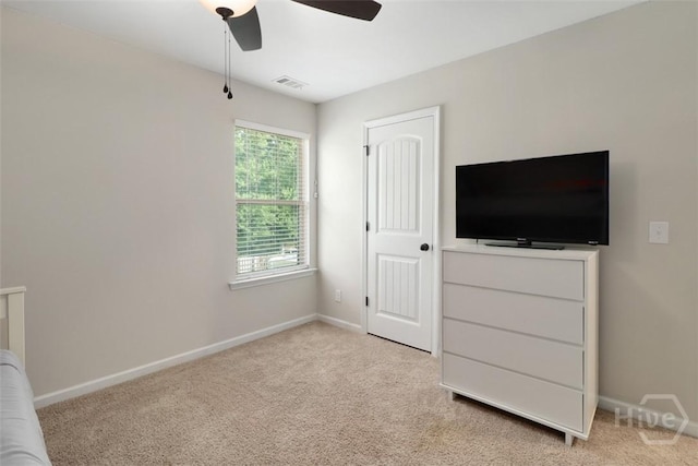 304 Boomer Ct, Guyton, GA 31312 - unfurnished bedroom with light carpet, baseboards, and a ceiling fan
