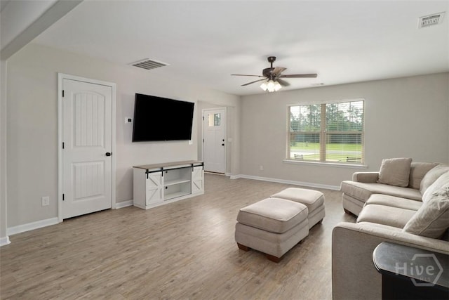 304 Boomer Ct, Guyton, GA 31312 - living area with baseboards, light wood-style flooring, and ceiling fan
