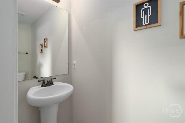 304 Boomer Ct, Guyton, GA 31312 - bathroom featuring toilet