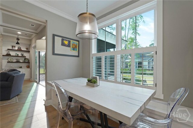 315 Linkside Lake Dr, Richmond Hill, GA 31324 - dining space with ornamental molding and light wood-style flooring