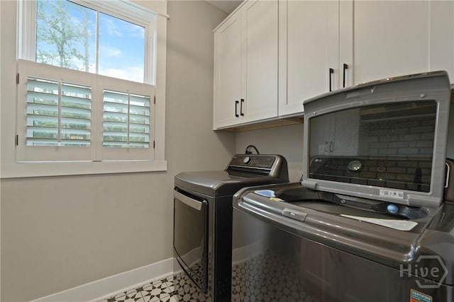 315 Linkside Lake Dr, Richmond Hill, GA 31324 - laundry area featuring cabinet space, washing machine and dryer, and baseboards