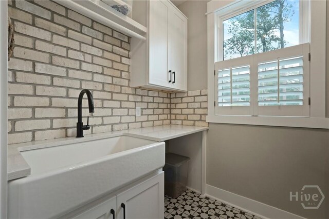 315 Linkside Lake Dr, Richmond Hill, GA 31324 - washroom featuring a sink and baseboards