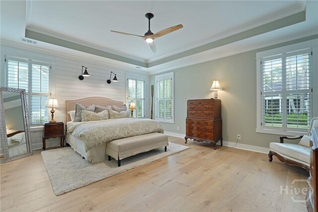 315 Linkside Lake Dr, Richmond Hill, GA 31324 - bedroom with a raised ceiling, crown molding, light wood finished floors, baseboards, and ceiling fan