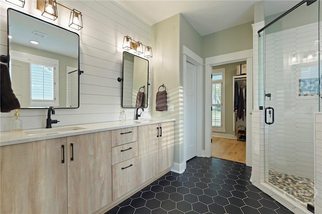 315 Linkside Lake Dr, Richmond Hill, GA 31324 - full bathroom with double vanity, a shower stall, and tile patterned flooring