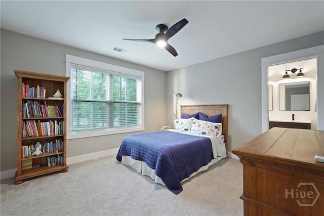 315 Linkside Lake Dr, Richmond Hill, GA 31324 - bedroom with carpet, baseboards, ensuite bath, and a ceiling fan