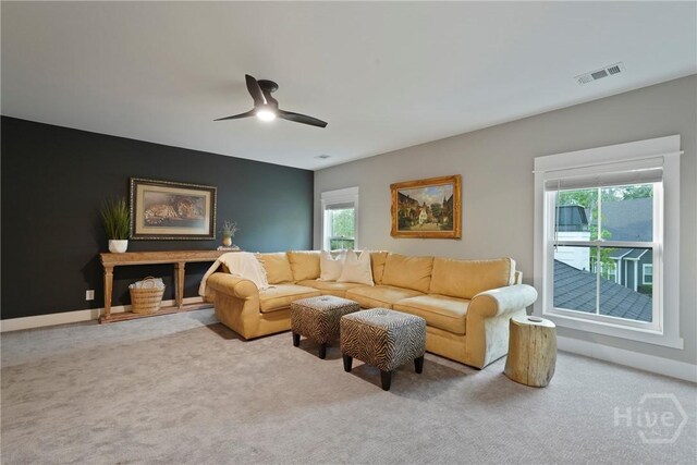 315 Linkside Lake Dr, Richmond Hill, GA 31324 - carpeted living room featuring plenty of natural light and a ceiling fan