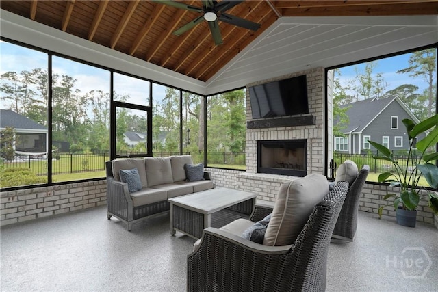 315 Linkside Lake Dr, Richmond Hill, GA 31324 - sunroom / solarium featuring a ceiling fan, vaulted ceiling, and an outdoor living space with a fireplace