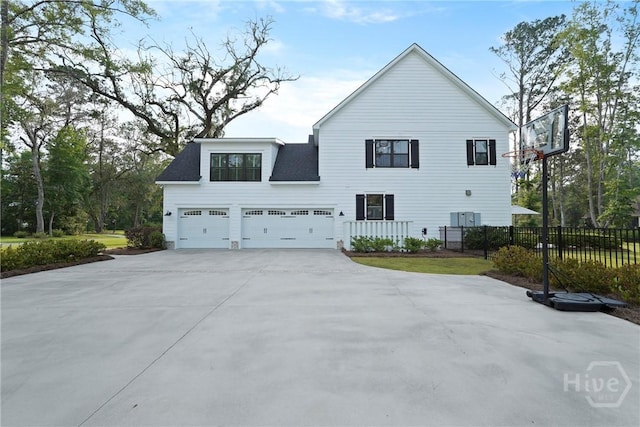 315 Linkside Lake Dr, Richmond Hill, GA 31324 - view of side of home featuring a garage and concrete driveway