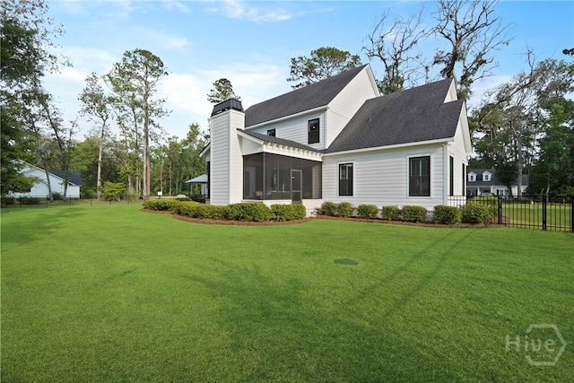 315 Linkside Lake Dr, Richmond Hill, GA 31324 - rear view of property featuring a chimney, a sunroom, and roof with shingles