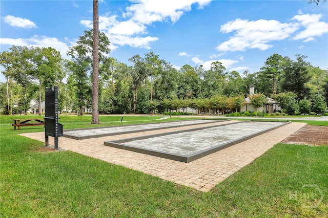 315 Linkside Lake Dr, Richmond Hill, GA 31324 - view of property's community with a game area, a yard, and view of wooded area