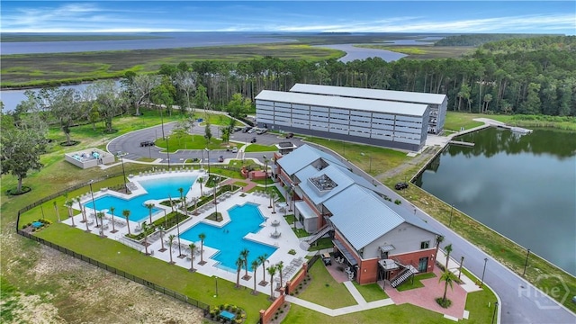 315 Linkside Lake Dr, Richmond Hill, GA 31324 - bird's eye view of a pool area, a nearby body of water, and a forest