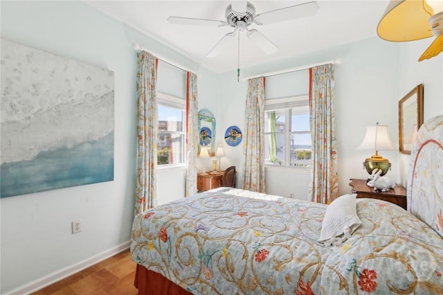 5 Northshore Dr, Tybee Island, GA 31328 - bedroom with wood finished floors, baseboards, and ceiling fan