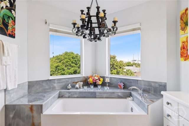 5 Northshore Dr, Tybee Island, GA 31328 - full bath featuring a chandelier, plenty of natural light, a bath, and vanity