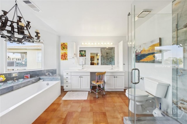 5 Northshore Dr, Tybee Island, GA 31328 - bathroom featuring vanity, a bath, a stall shower, a chandelier, and toilet