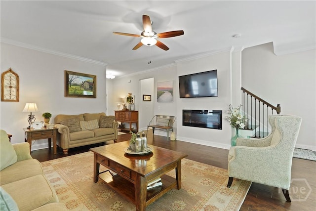 20 Oakcrest Ct, Savannah, GA 31405 - living area featuring ornamental molding, a ceiling fan, wood finished floors, a glass covered fireplace, and baseboards