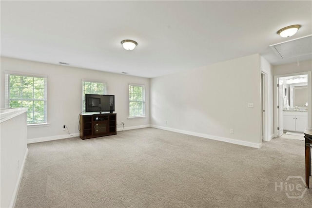 20 Oakcrest Ct, Savannah, GA 31405 - unfurnished living room with attic access, carpet flooring, and baseboards
