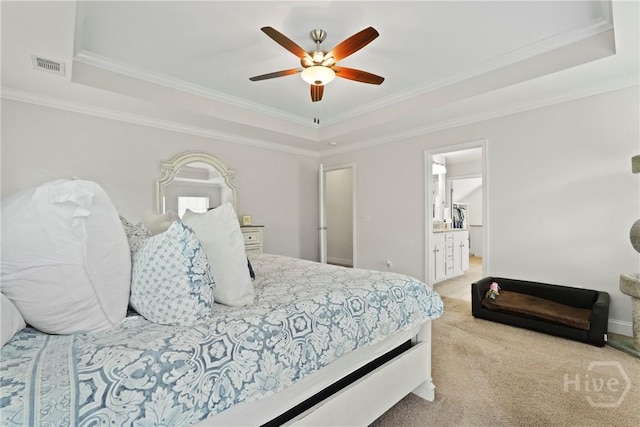 20 Oakcrest Ct, Savannah, GA 31405 - carpeted bedroom featuring a raised ceiling, ornamental molding, a ceiling fan, baseboards, and ensuite bathroom