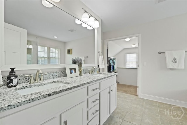 20 Oakcrest Ct, Savannah, GA 31405 - full bath with double vanity, plenty of natural light, tile patterned flooring, and baseboards