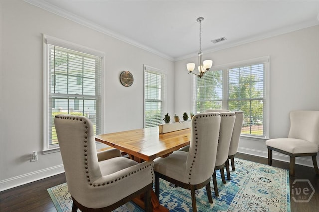 20 Oakcrest Ct, Savannah, GA 31405 - dining space featuring a chandelier, plenty of natural light, dark wood-type flooring, and crown molding