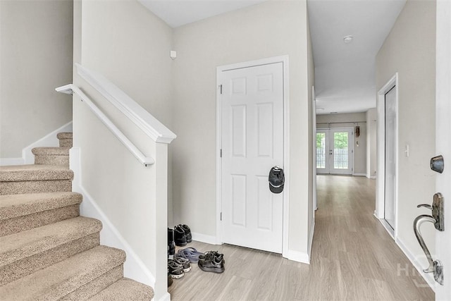 194 Calm Oaks Cir, Savannah, GA 31419 - entrance foyer featuring light wood-style flooring, stairs, and baseboards