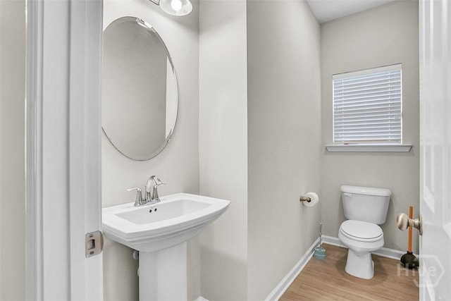 194 Calm Oaks Cir, Savannah, GA 31419 - half bath with toilet, baseboards, and wood finished floors