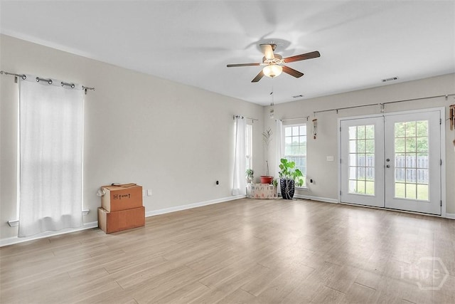 194 Calm Oaks Cir, Savannah, GA 31419 - spare room featuring a ceiling fan, french doors, light wood-style floors, and baseboards