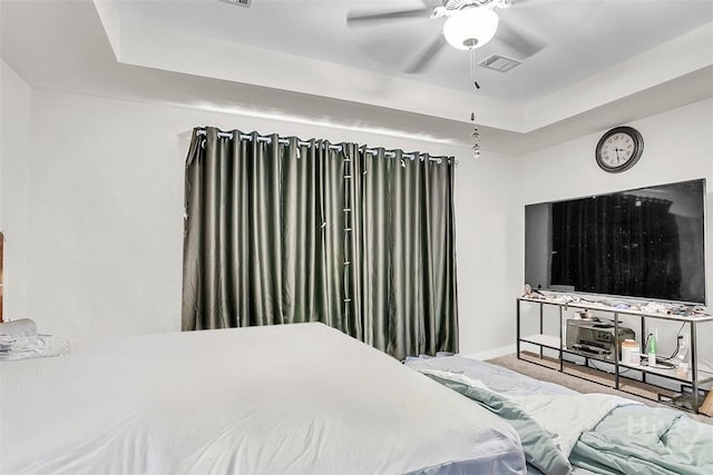194 Calm Oaks Cir, Savannah, GA 31419 - bedroom with baseboards, a tray ceiling, carpet flooring, and ceiling fan