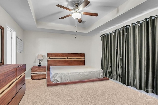 194 Calm Oaks Cir, Savannah, GA 31419 - carpeted bedroom with a tray ceiling, a ceiling fan, and baseboards