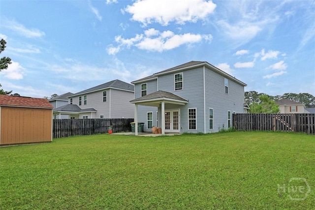 194 Calm Oaks Cir, Savannah, GA 31419 - back of house featuring french doors, a patio area, and an outbuilding