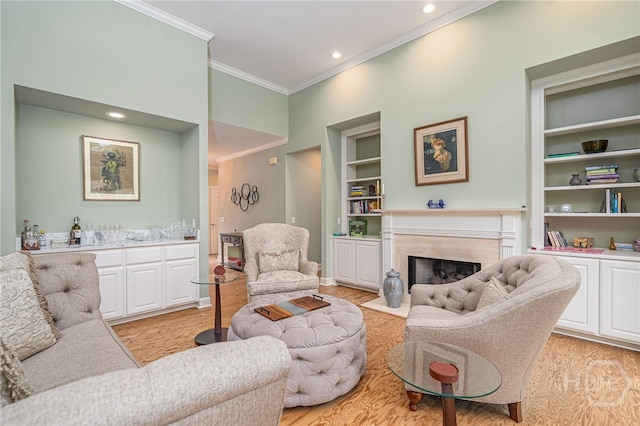 6 Pine Shadow Ct, Savannah, GA 31411 - living area featuring crown molding, built in features, a fireplace, recessed lighting, and light wood finished floors