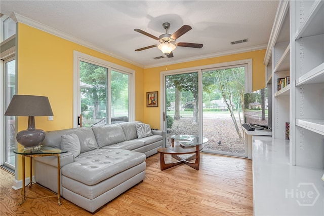 6 Pine Shadow Ct, Savannah, GA 31411 - living room with ornamental molding, a ceiling fan, and light wood-style flooring