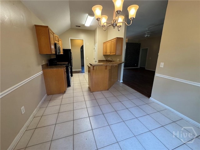 415 Copper Creek Cir, Pooler, GA 31322 - kitchen with stove, light tile patterned floors, lofted ceiling, ceiling fan, and a kitchen breakfast bar