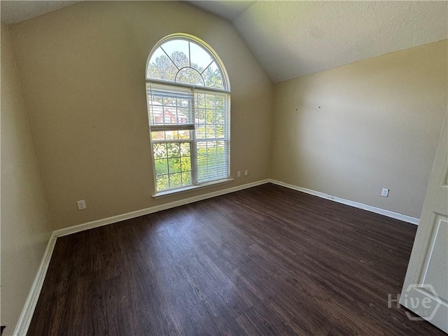415 Copper Creek Cir, Pooler, GA 31322 - unfurnished room featuring dark wood-style floors, lofted ceiling, and baseboards