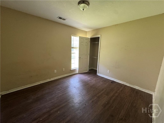 415 Copper Creek Cir, Pooler, GA 31322 - unfurnished bedroom featuring dark wood-style flooring, baseboards, and a closet