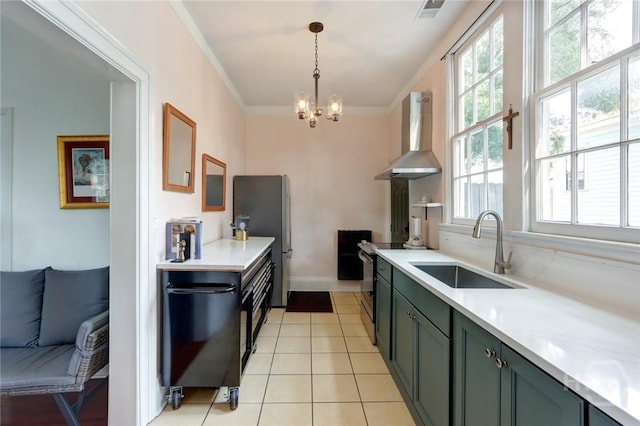 123 W Park Ave Unit 2, Savannah, GA 31401 - kitchen featuring wall chimney range hood, a sink, freestanding refrigerator, light countertops, and electric range oven
