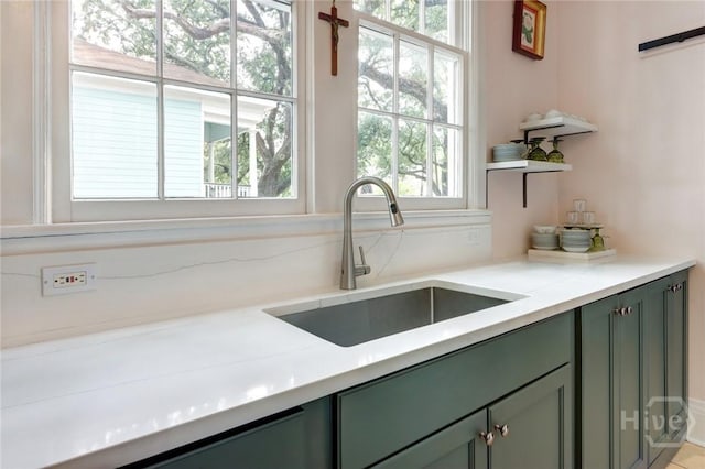 123 W Park Ave Unit 2, Savannah, GA 31401 - kitchen with green cabinets, a sink, and open shelves
