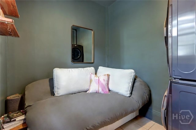 123 W Park Ave Unit 2, Savannah, GA 31401 - bedroom with stacked washer and clothes dryer and light tile patterned floors