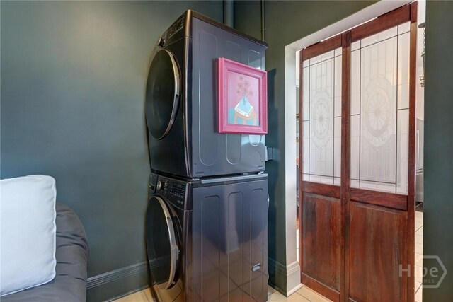 123 W Park Ave Unit 2, Savannah, GA 31401 - laundry area with stacked washer / drying machine and baseboards