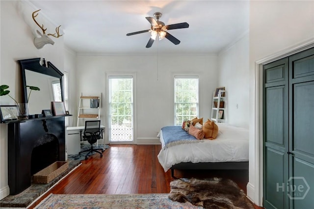 123 W Park Ave Unit 2, Savannah, GA 31401 - bedroom with dark wood finished floors, baseboards, crown molding, and ceiling fan