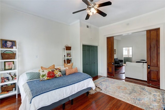 123 W Park Ave Unit 2, Savannah, GA 31401 - bedroom with wood finished floors, ornamental molding, a closet, and a ceiling fan