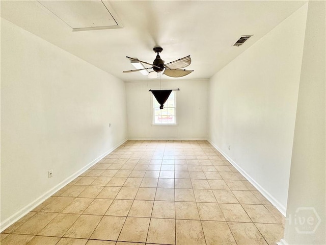 5 Ossabaw Rd, Savannah, GA 31410 - spare room with light tile patterned floors, a ceiling fan, and baseboards