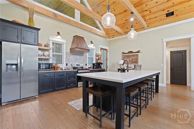 39 Bird Dog Ln, Midway, GA 31320 - kitchen with stainless steel appliances, premium range hood, wood ceiling with exposed beams, open shelves, and light countertops