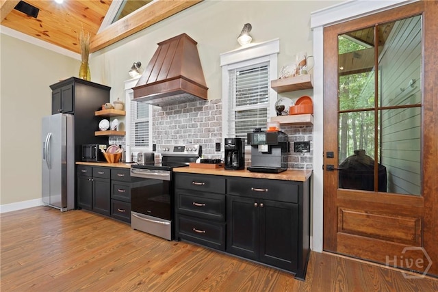 39 Bird Dog Ln, Midway, GA 31320 - kitchen featuring stainless steel appliances, open shelves, custom exhaust hood, light wood-style floors, and wooden ceiling